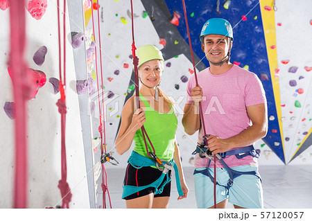 Two confident athletes at bouldering gym Two confident athletes at bouldering gym 57120057