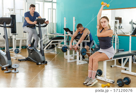 Group of people exercising with weight Group of people exercising with weight 57120076