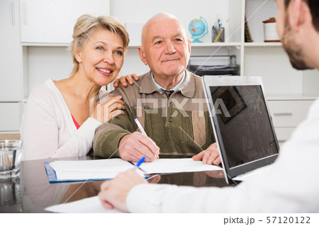 Old man and woman in social department Old man and woman in social department 57120122