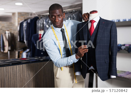 Designer is creating business image with red tie 57120842