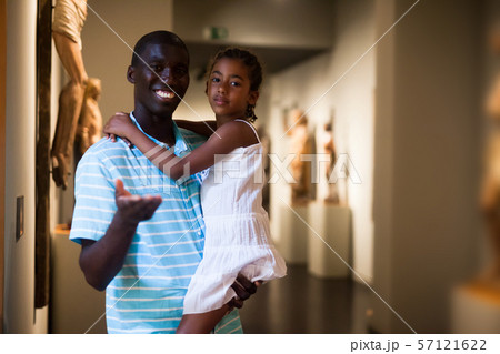 Man and his daughter looking at medieval art Man and his daughter looking at medieval art 57121622