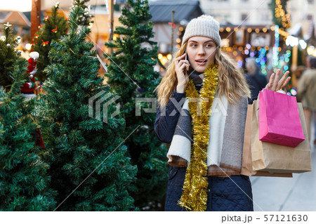 Girl choosing Christmas tree 57121630
