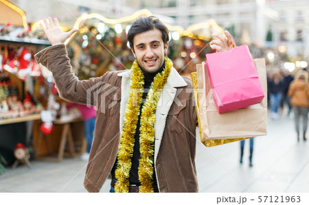 Man expression happinnes from buying decoration at Christmas fair 57121963