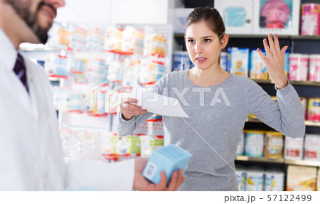 Outraged woman client in pharmacy Outraged woman client in pharmacy 57122499