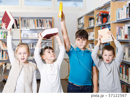 Happy children in school library Happy children in school library 57122567