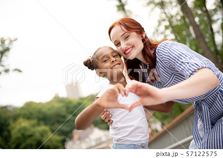 Daughter and mommy feeling truly contended together 57122575