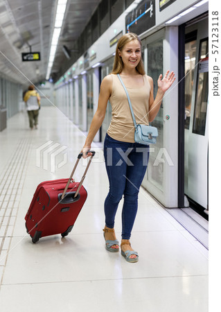 Woman entering subway car 57123118