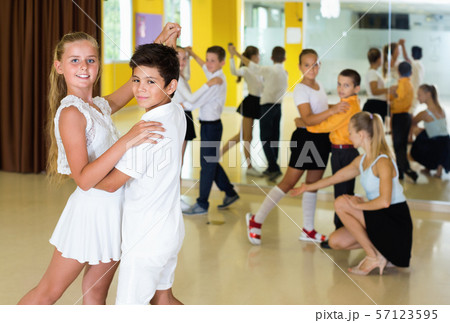 Little boys and girls having dancing class in classroom 57123595