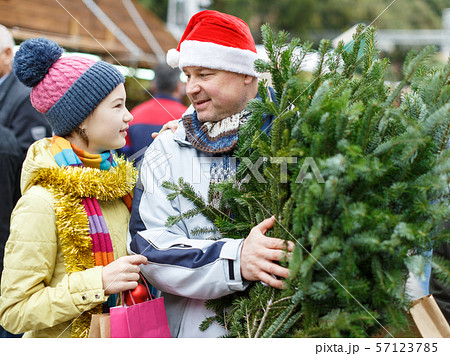 Girl and father with Christmas tree 57123785