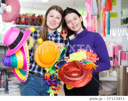Girls in store of festival accessories Girls in store of festival accessories 57123851