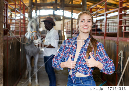 Portrait of girl at horse stable 57124318