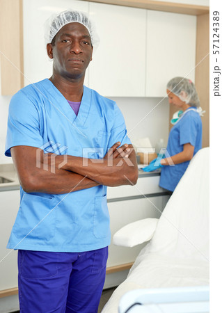 Cosmetician man before procedure in clinic of esthetic cosmetology Cosmetician man before procedure in clinic of esthetic cosmetology 57124389