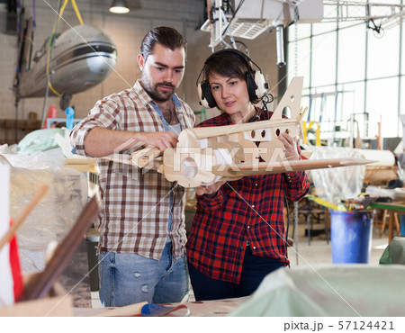 Couple modeling airplanes 57124421