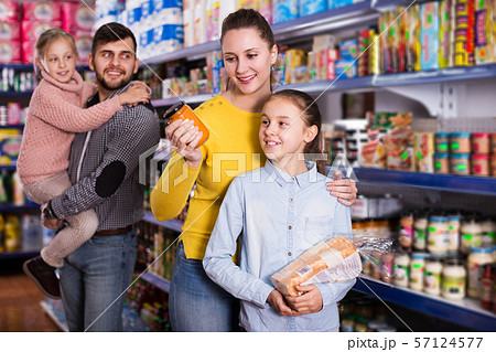 family shopping together in grocery store family shopping together in grocery store 57124577