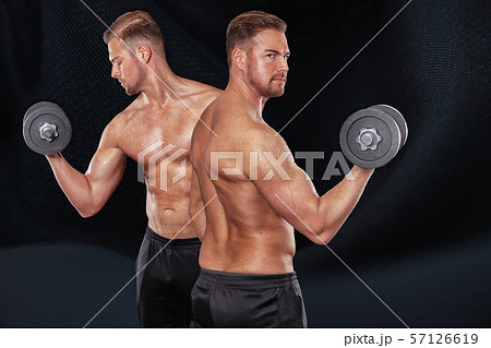 midsection of man with arms raised 57126619