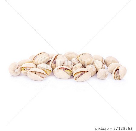 toasted pistachios on a white background 57128563