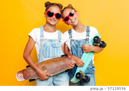 Two teenagers, stylish children posing with Two teenagers, stylish children posing with 57129556