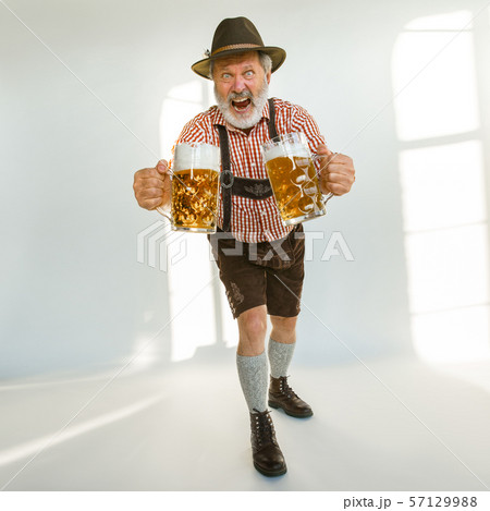 Portrait of Oktoberfest man, wearing the traditional Bavarian clothes Portrait of Oktoberfest man, wearing the traditional Bavarian clothes 57129988