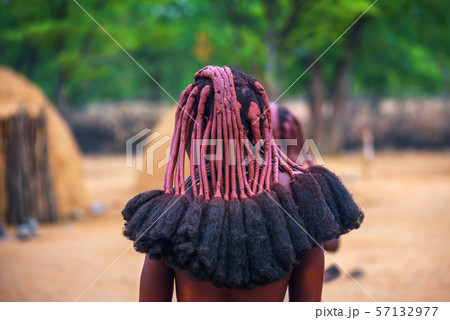 Traditional hairstyle of women in the Himba tribe photographed from behind 57132977