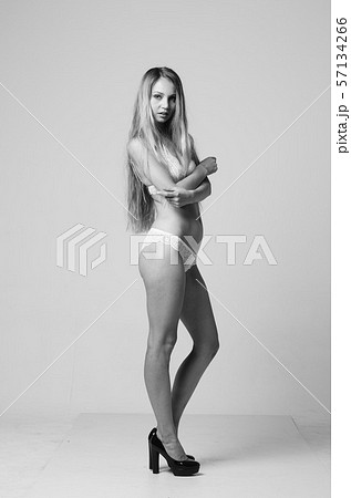 portrait of exquisite woman in lingerie sitting. portrait of exquisite woman in lingerie sitting. 57134266