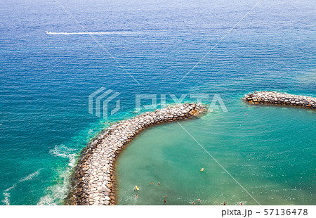 People swimming in a small lagoon 57136478