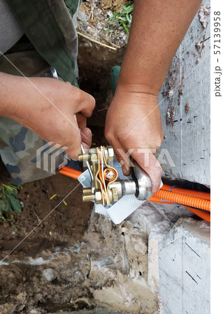 The master performs welding of a copper tube near 57139958
