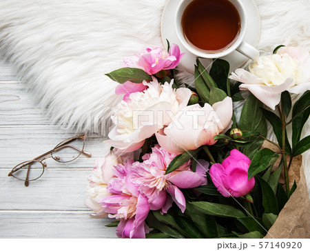 Cup of tea and pink peonies Cup of tea and pink peonies 57140920