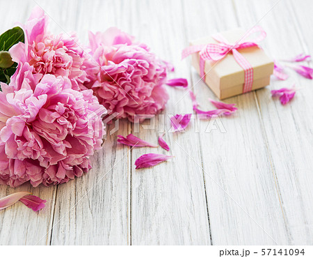 Background with peonies and gift box 57141094