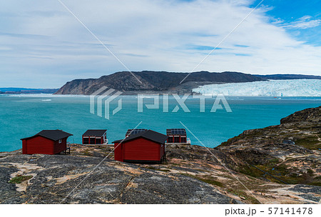 Greenland glacier nature landscape with famous Eqi glacier and lodge cabins Greenland glacier nature landscape with famous Eqi glacier and lodge cabins 57141478