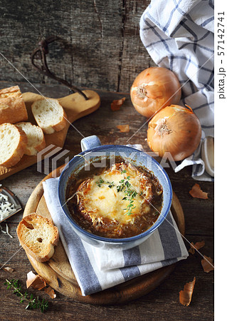French onions soup with baguette, rustic style French onions soup with baguette, rustic style 57142741