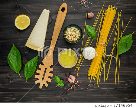 The thin spaghetti on black wooden background. The thin spaghetti on black wooden background. 57146954