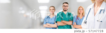 Doctor working in hospital with other doctors. 57147728