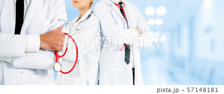 Doctor working in hospital with other doctors. 57148181