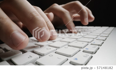 Close-up soft-focus finger typing on keyboard. Close-up soft-focus finger typing on keyboard. 57148182