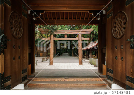 Meiji Jingu Shrine wooden Torii seen through old 57148481