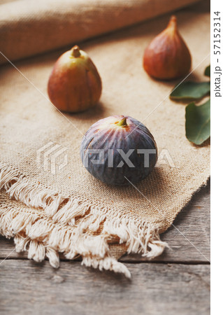 Figs on the table, group of fruits on a wooden Figs on the table, group of fruits on a wooden 57152314
