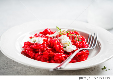 Pink beetroot risotto with feta cheese Pink beetroot risotto with feta cheese 57154149
