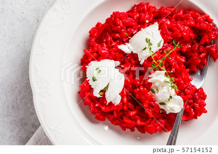 Pink beetroot risotto with feta cheese Pink beetroot risotto with feta cheese 57154152