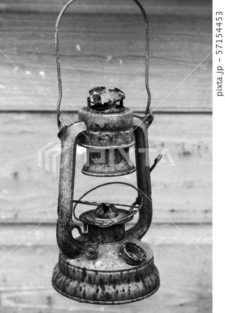 Old rusted red kerosene lamp 57154453