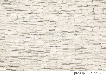 Rock stone brick tile wall aged texture detailed pattern background in cream beige brown color 57155328