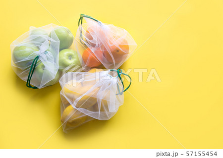 Fruits in reusable eco-friendly mesh bags. 57155454