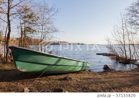 old green boat on the lake coast old green boat on the lake coast 57155820
