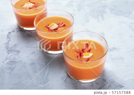 Salmorejo, Spanish chilled tomato and bread soup, served in glasses, with a place for text 57157388