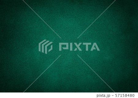 Dark green matt suede fabric closeup. Velvet Dark green matt suede fabric closeup. Velvet 57158480