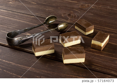 Two colours nougat on brown wood 57164073