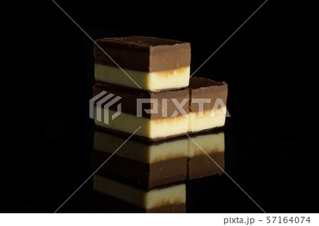 Two colours nougat isolated on black glass 57164074