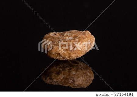 Choco balls cereal isolated on black glass Choco balls cereal isolated on black glass 57164191