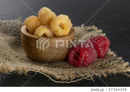 Fresh hymalayan raspberry on grey stone 57164330