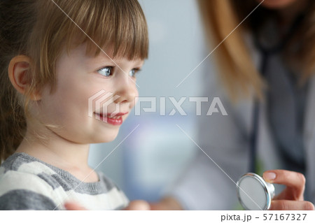 Small smiling kid on meeting with doctor Small smiling kid on meeting with doctor 57167327