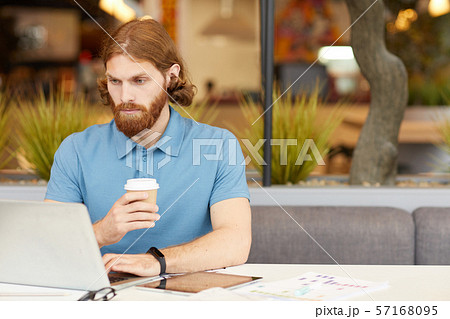 Businessman working in cafe Businessman working in cafe 57168095